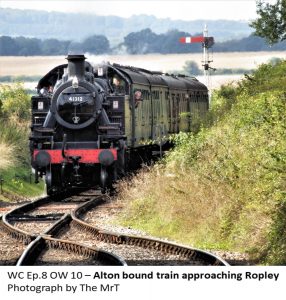 Passenger steam train approaching Ropley